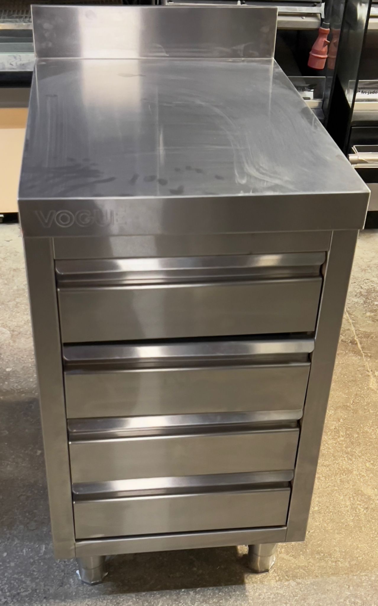 a7bc82c5-54f1-4259-ac40-052503c6c116.jpeg Stainless Steel Table - Four Drawrs - Image 1